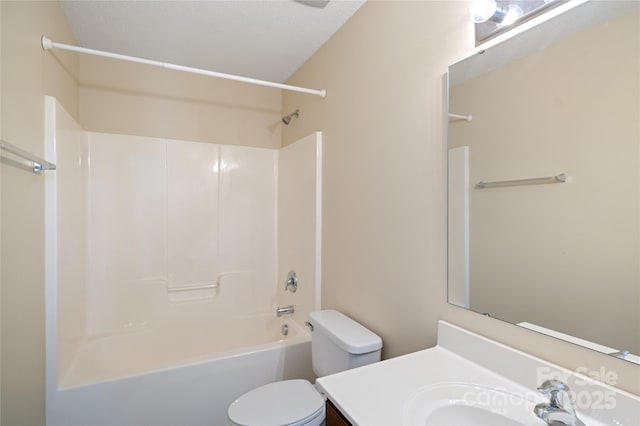 full bathroom featuring vanity, toilet, and washtub / shower combination