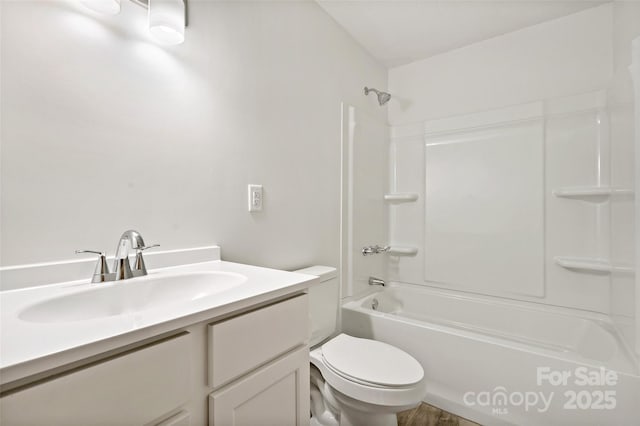 bathroom featuring toilet, shower / tub combination, and vanity