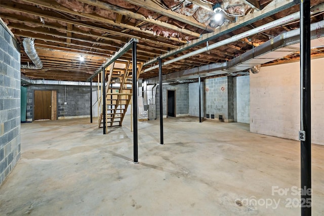 unfinished basement featuring heating unit