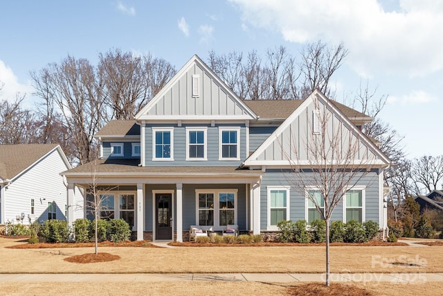 craftsman house featuring a porch, board and batten siding, and roof with shingles