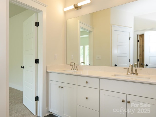 full bath with a sink and double vanity