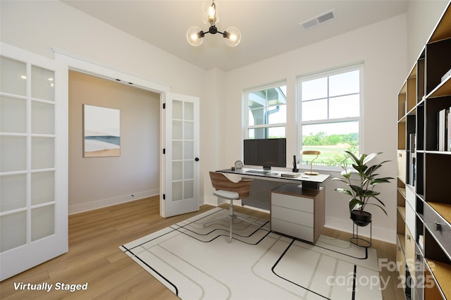 17021 Malone Ln, Mint Hill, NC 28227 - office space featuring french doors, baseboards, light wood-style flooring, and a chandelier