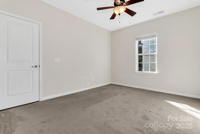 spare room with baseboards, visible vents, ceiling fan, and carpet flooring