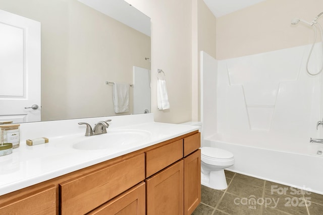 bathroom with tile patterned floors, vanity, toilet, and shower / bathtub combination