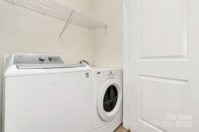 laundry area with laundry area and washing machine and dryer