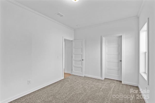 unfurnished bedroom featuring carpet and ornamental molding