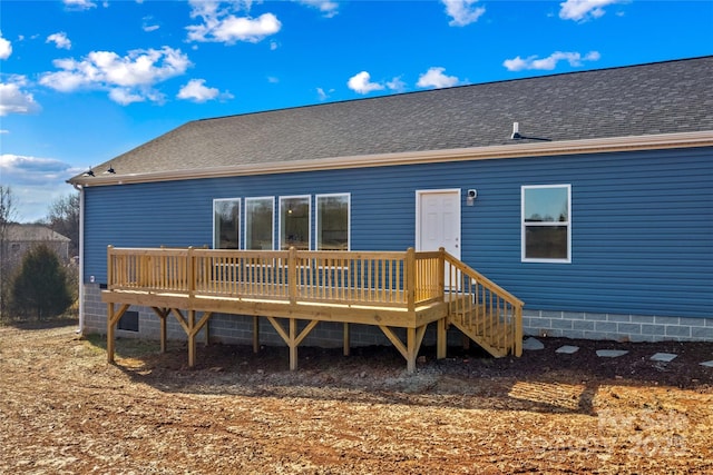 back of house featuring a deck