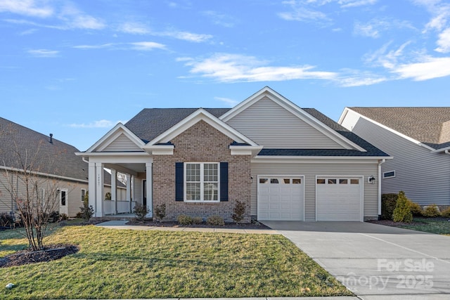 view of front facade with an attached garage, a front lawn, concrete driveway, and brick siding