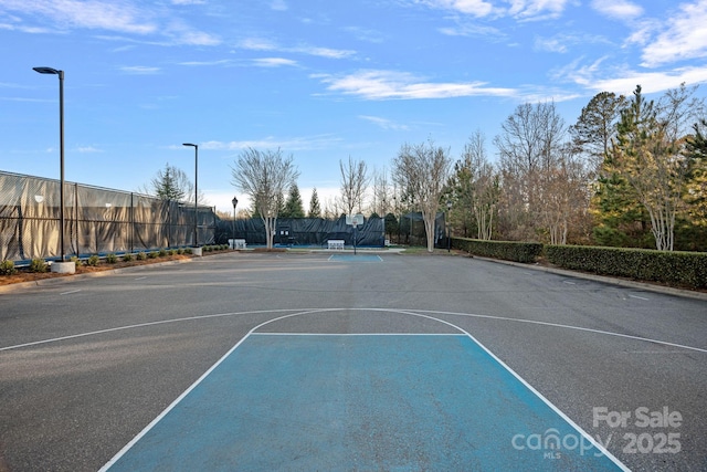 view of sport court with community basketball court and fence