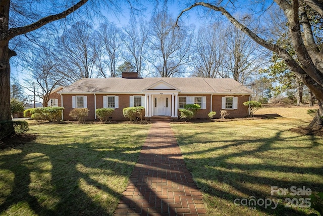 ranch-style house with crawl space, a chimney, a front lawn, and brick siding