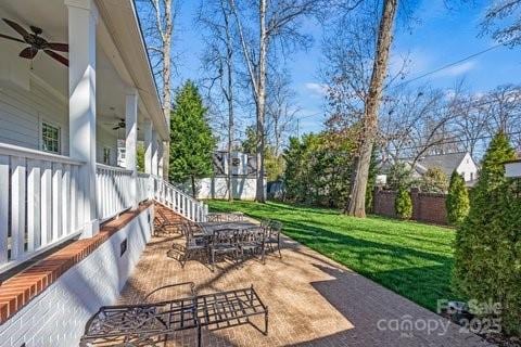 view of patio / terrace featuring ceiling fan and outdoor dining space