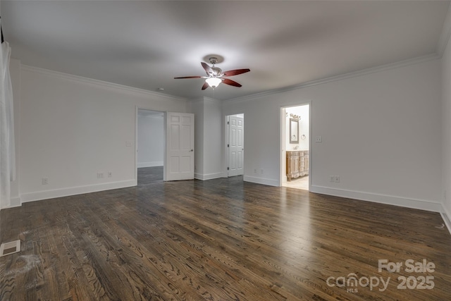 interior space featuring ornamental molding, dark wood-style flooring, visible vents, and baseboards