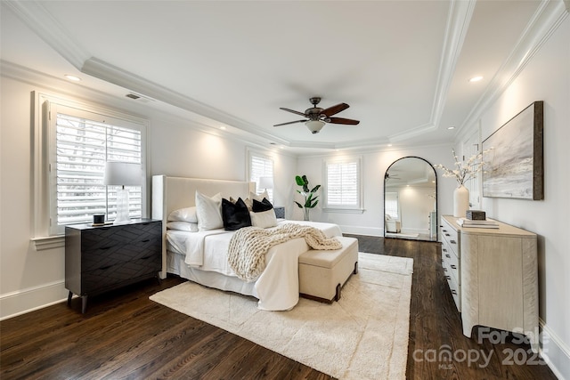 bedroom featuring ornamental molding, visible vents, dark wood finished floors, and baseboards