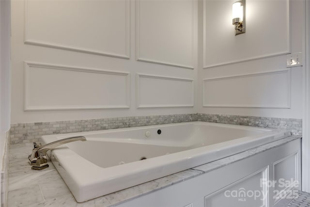 bathroom with a jetted tub