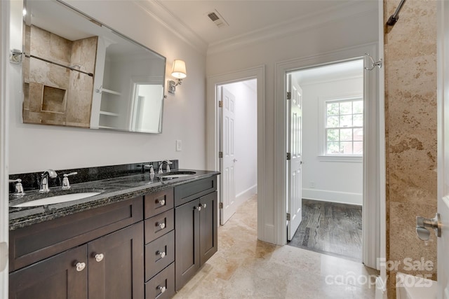 full bathroom with double vanity, ornamental molding, a sink, and visible vents