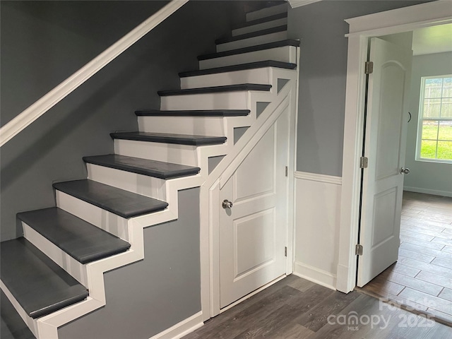 stairs with baseboards and wood finished floors