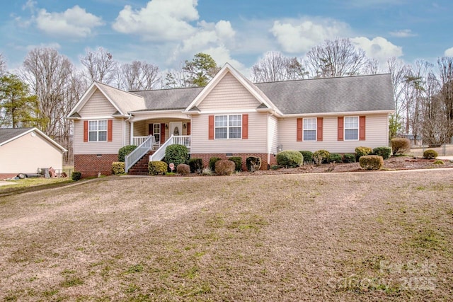 single story home featuring a front yard, crawl space, and covered porch