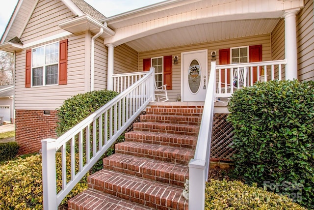 doorway to property featuring crawl space, a shingled roof, and a porch