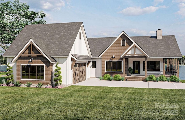 view of front facade with covered porch, a chimney, board and batten siding, and a front yard