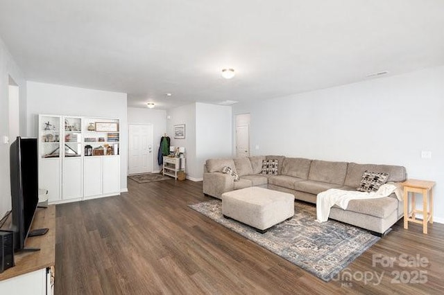 living area with dark wood-style floors