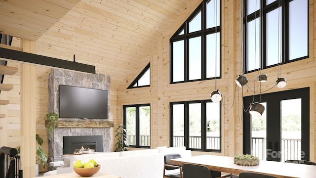 living room featuring a fireplace, wooden ceiling, and wood walls