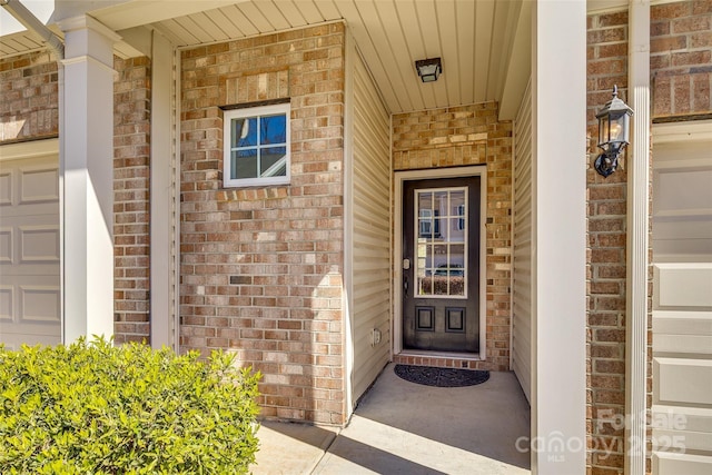 property entrance with brick siding