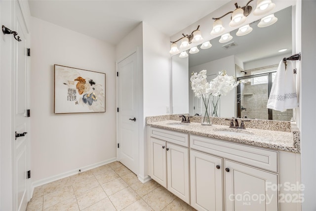 bathroom featuring tile patterned flooring, a shower stall, visible vents, and a sink