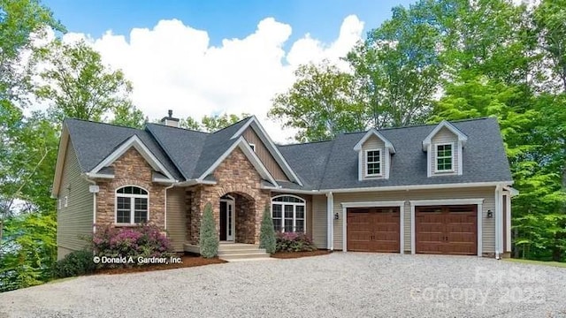 view of front of home with a garage, stone siding, driveway, and a shingled roof