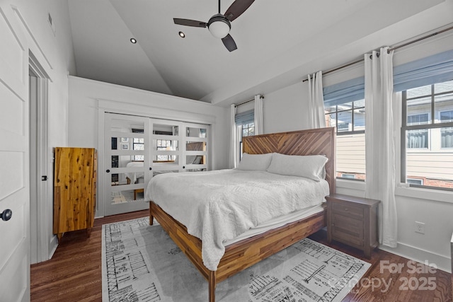 bedroom featuring dark wood-type flooring, recessed lighting, multiple windows, and vaulted ceiling