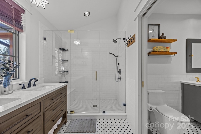 full bathroom featuring tile walls, double vanity, toilet, a sink, and a shower stall