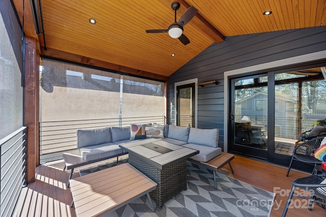 sunroom / solarium with lofted ceiling with beams, ceiling fan, and wooden ceiling