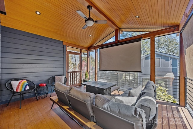 wooden terrace with ceiling fan and outdoor lounge area