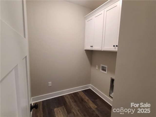 laundry room featuring cabinets, dark hardwood / wood-style flooring, and hookup for a washing machine