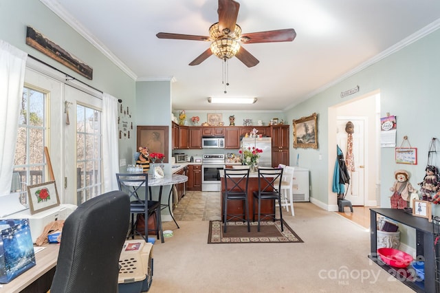 dining room with baseboards, ornamental molding, ceiling fan, and light colored carpet