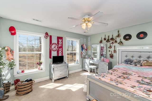 bedroom with light carpet, baseboards, visible vents, and ceiling fan