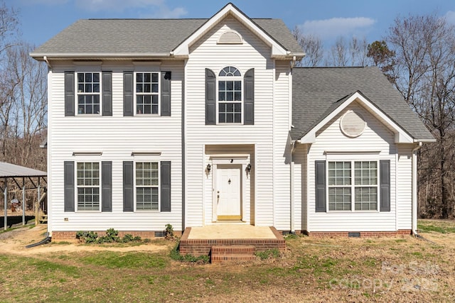 view of front of house featuring a shingled roof, a front yard, and crawl space