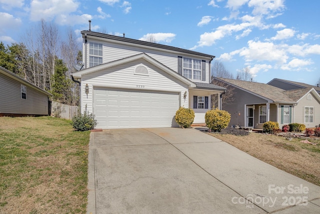 traditional-style house with concrete driveway, a front lawn, an attached garage, and fence