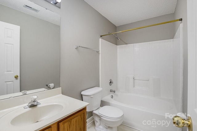 bathroom featuring visible vents, toilet, tub / shower combination, a textured ceiling, and vanity