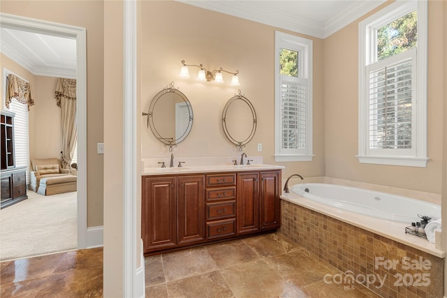 bathroom with double vanity, a garden tub, crown molding, and a sink