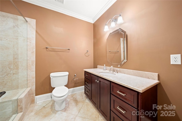 bathroom with baseboards, tiled shower, toilet, crown molding, and vanity