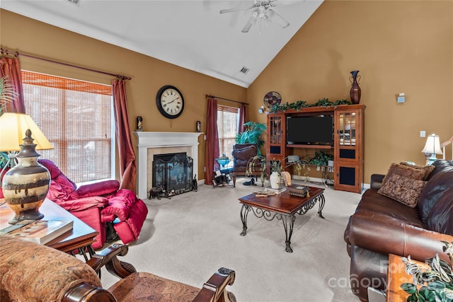 living area featuring visible vents, a high end fireplace, carpet flooring, ceiling fan, and high vaulted ceiling