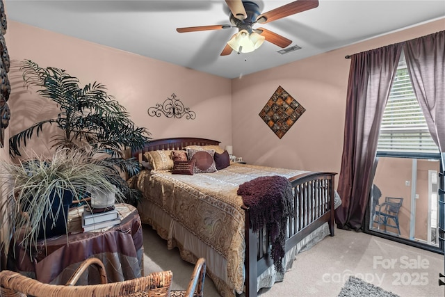 bedroom featuring ceiling fan, carpet flooring, and visible vents