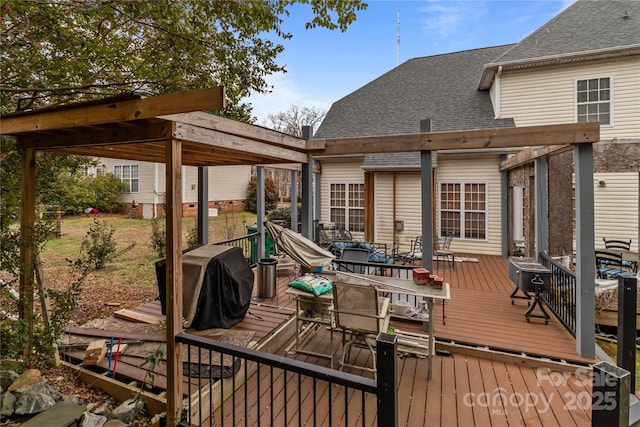 wooden terrace featuring outdoor dining area and area for grilling