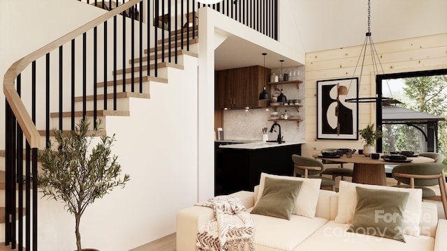 living room with a towering ceiling