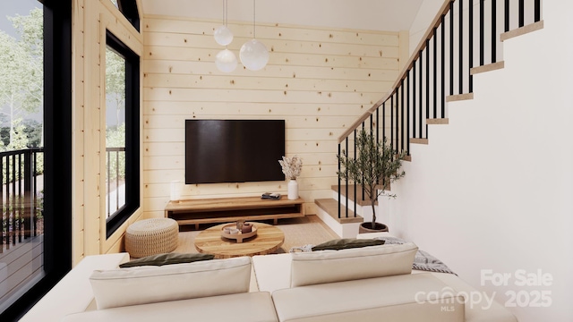 living room with wood walls