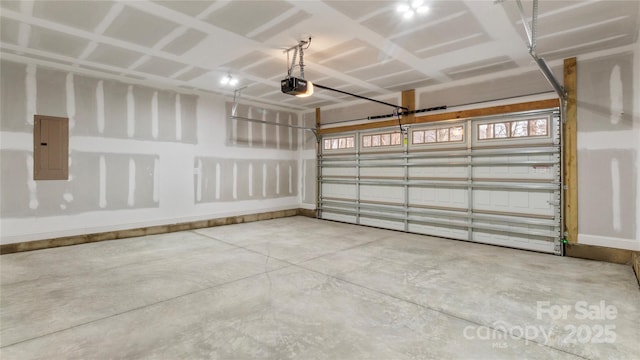 garage featuring electric panel and a garage door opener