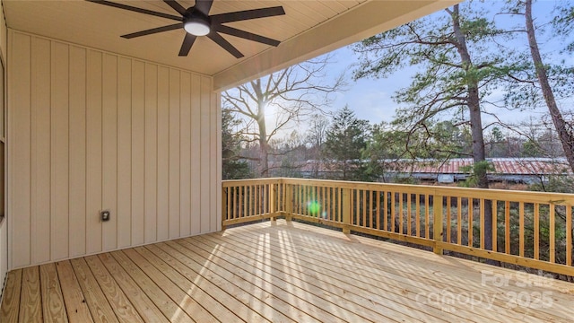 wooden terrace with a ceiling fan