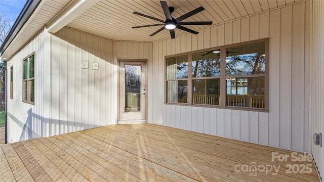 wooden deck featuring a ceiling fan