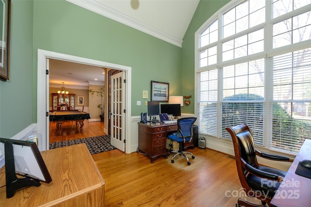 office area with light wood-type flooring, high vaulted ceiling, crown molding, and french doors