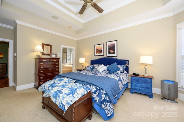 bedroom featuring carpet floors, a raised ceiling, ornamental molding, connected bathroom, and baseboards